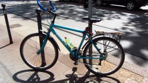 Blue bicycle parked with shadows Italy - Photo by Patty Mooney San Diego video production