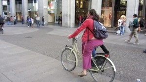 Bicycles of Italy Milan woman - Photo by Patty Mooney of San Diego video production