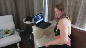 Blogger Patty Mooney relaxing with laptop in San Diego Hard Rock suite