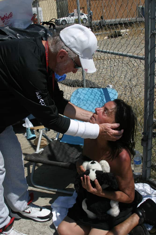 dave the waterman ross embraces homeless woman