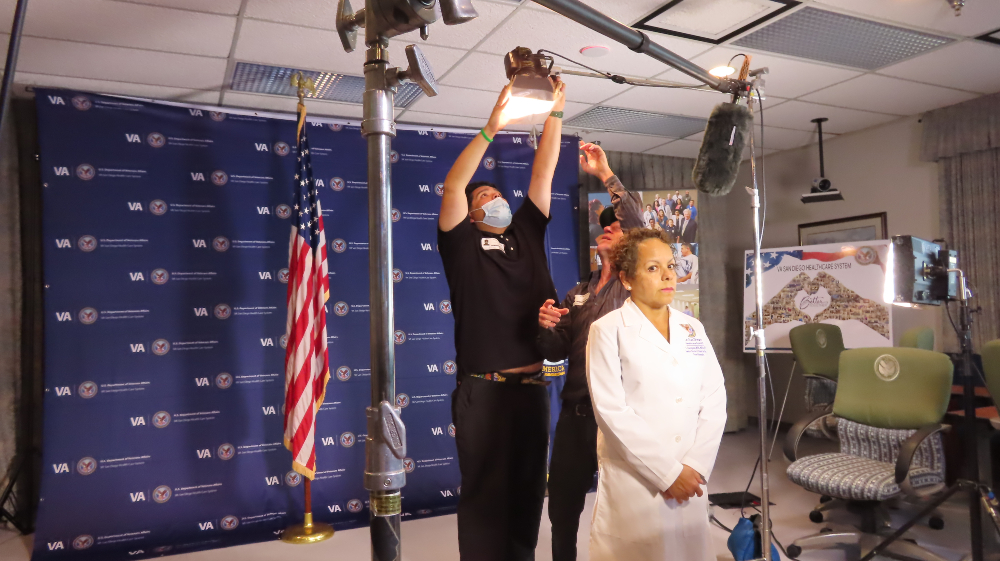 Video production crew sets up lighting for VA Patient Welcome Video