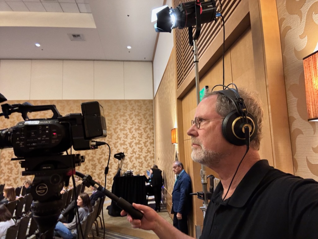 Greg Schumsky videotapes medical conference in San Diego