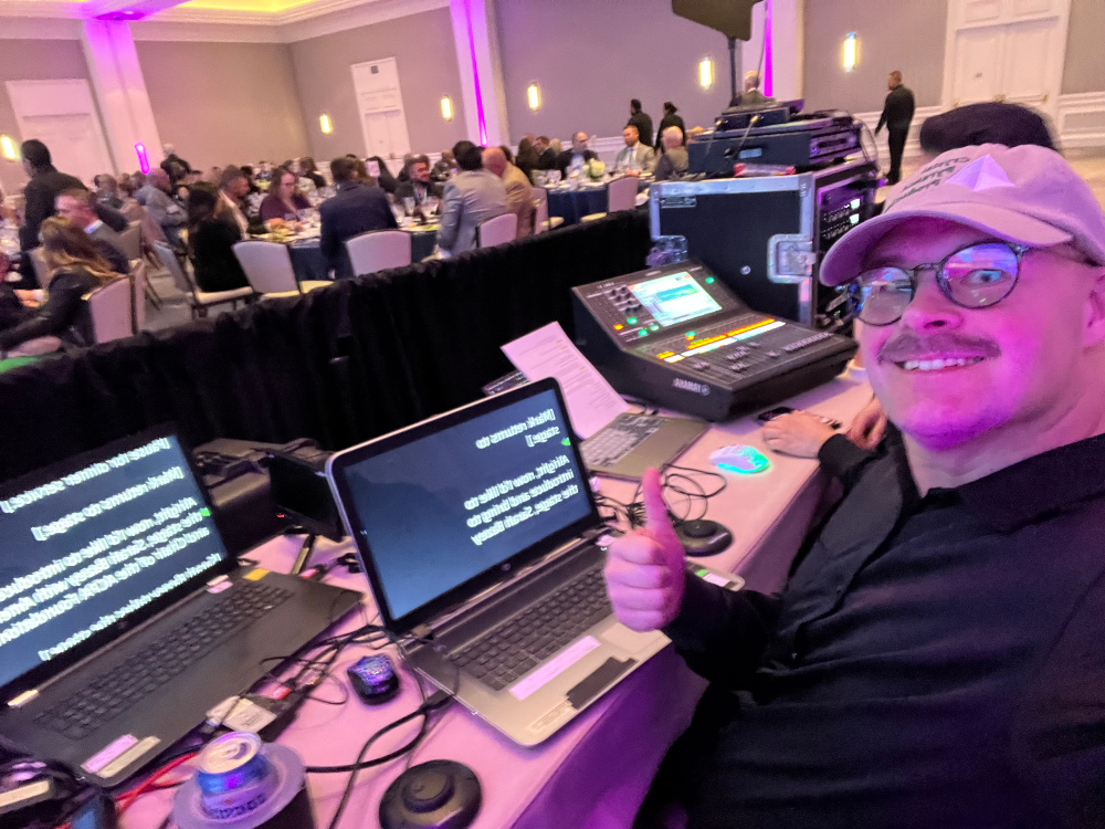 Wilson Large operating Presidential teleprompter during a San Diego event