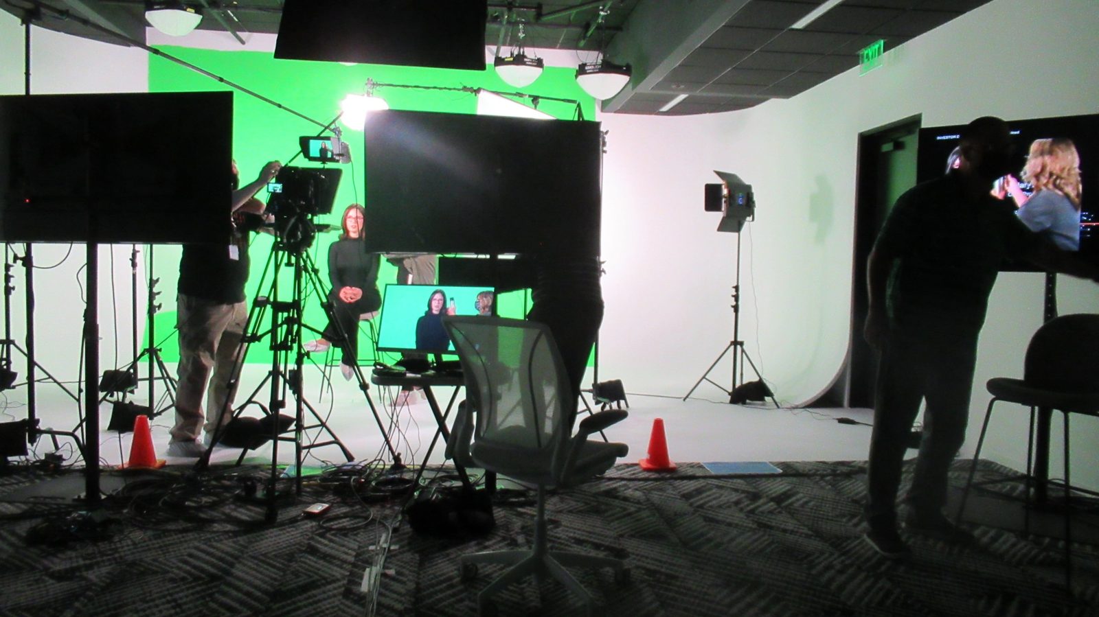 Green-screen studio interview with broadcast camera, lighting and live monitors on a Crystal Pyramid Productions shoot