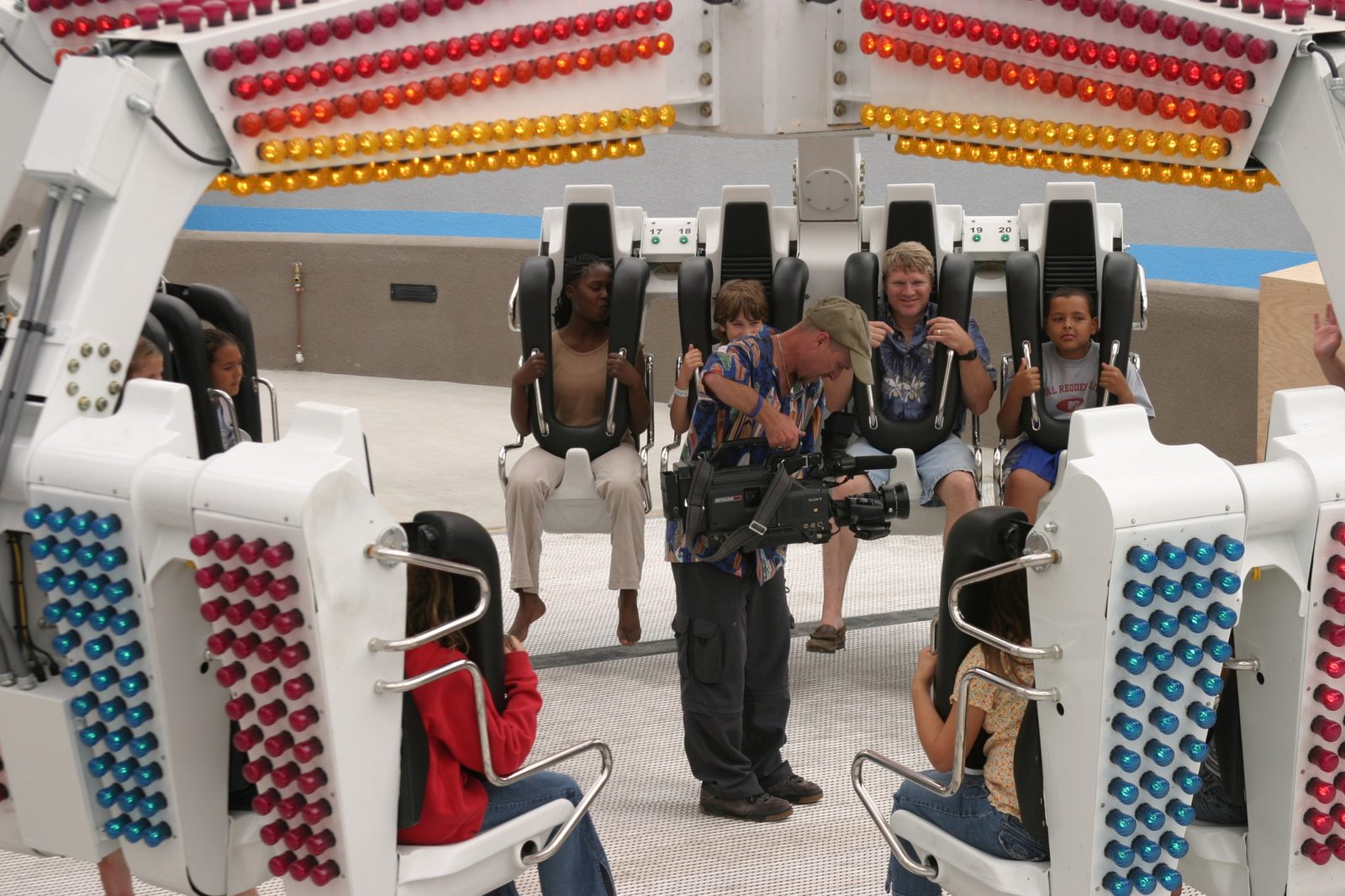 Videographer filming riders before the opening of the Revolution ride at Belmont Park, Mission Beach
